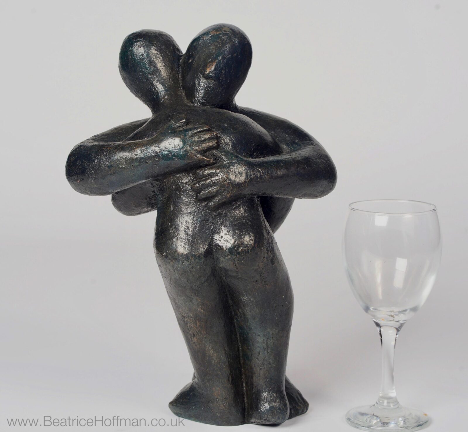 Modern affectionate bronze sculpture of a hug for a wedding anniversary