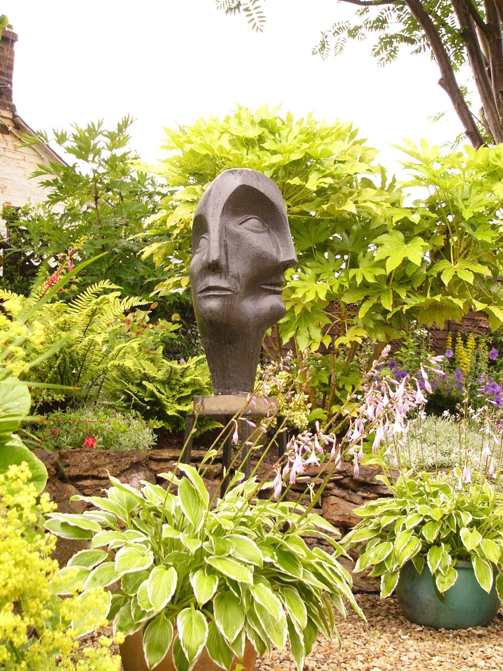 large contemporary garden bronze sculpture of a head based on Picasso