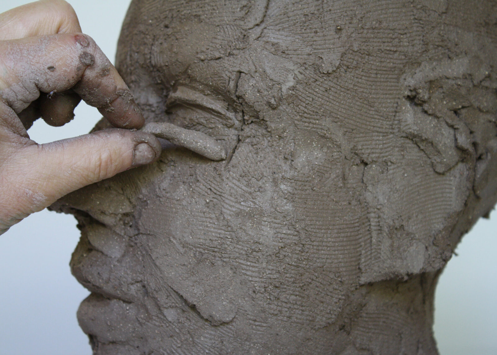 learning how to make a head out of clay and creating eyes