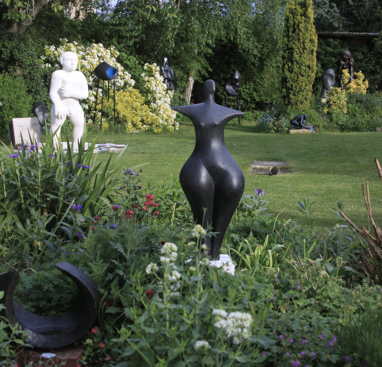 First Woman £2950 Bronze Resin 87 x 32 x 26cm Open Studio OAW 2016in the foreground Open Studio OAW 2016 contemporary sculpture garden in the open studio OAW 2016 near Oxford