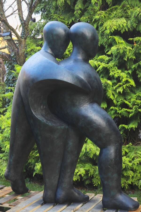 Large hospital commissioned bronze sculpture of two supportive figures