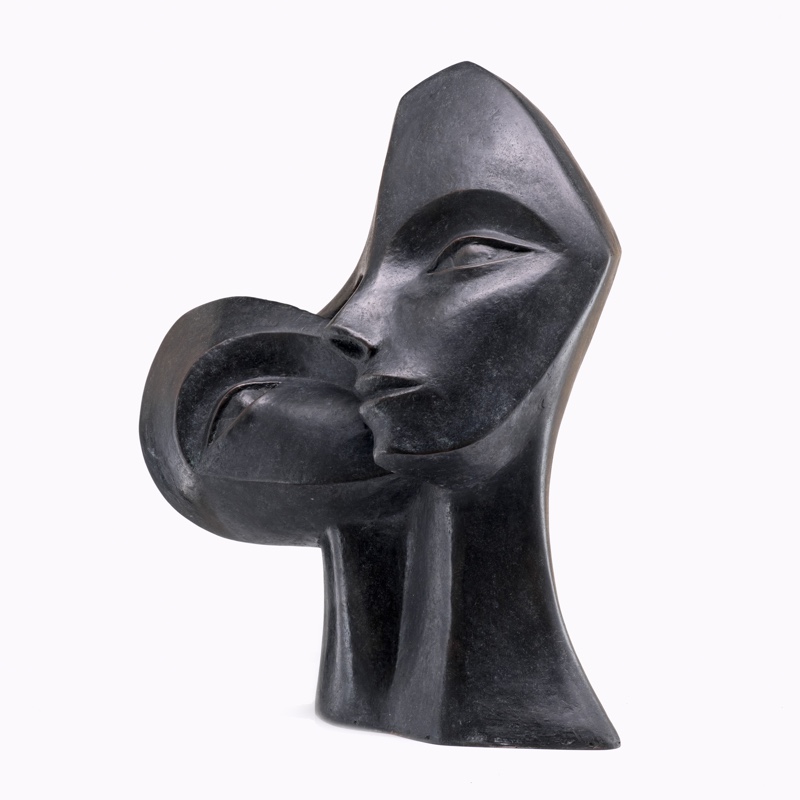 contemporary garden bronze sculpture of a double head loosely based on Picasso