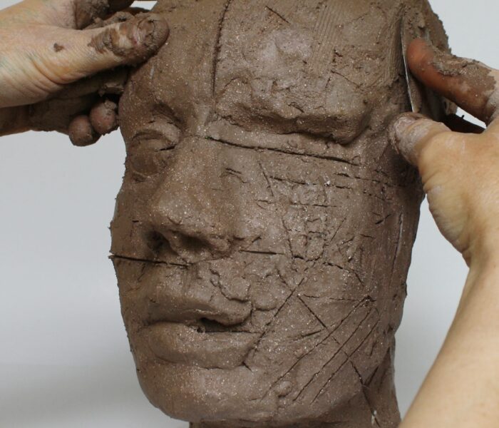 0087_27b) Blending in the added clay on right foreheadn with MK