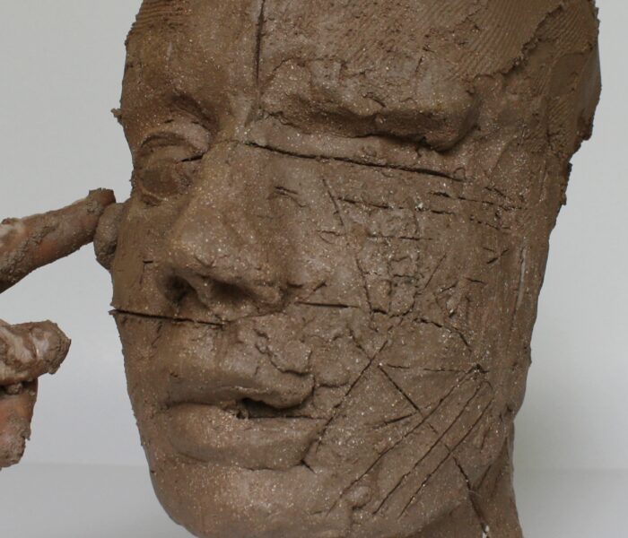 0101_31a) add clay to right cheek bone front view