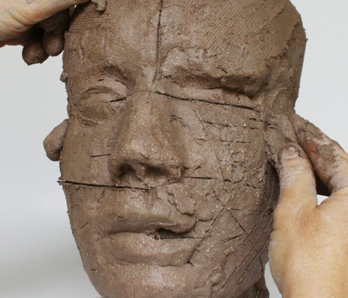 0103_31c) CHEEKBONES add clay with fingers on the right